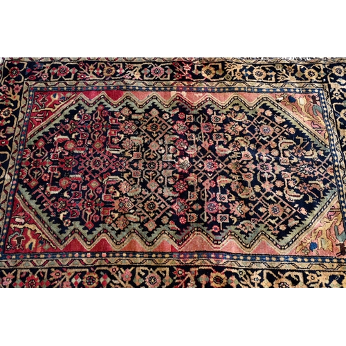 257 - A Persian Baluchi rug, double medallion on blue/brown ground, 167 x 98 cm to/w a Persian Hamadan rug... 