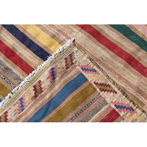 260 - A vintage multi-coloured strip design Kilim, 220 x 130cm