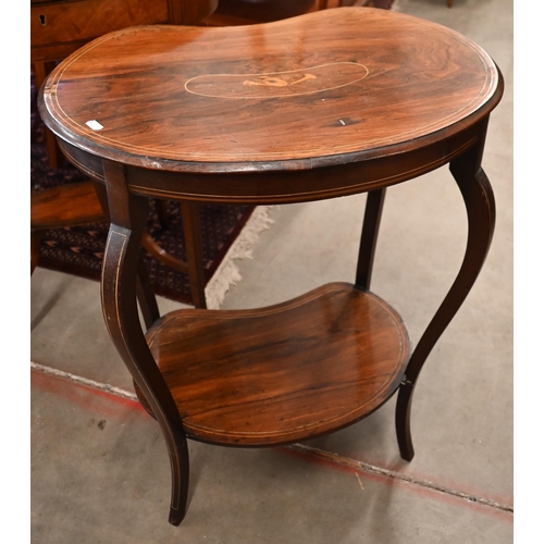 263 - # An Edwardian rosewood two-tier kidney shaped occasional table with inlaid musical instrument carto... 