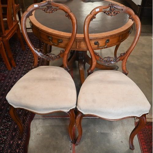 267 - A set of four Victorian carved walnut balloon back dining chairs (4)