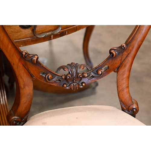 267 - A set of four Victorian carved walnut balloon back dining chairs (4)