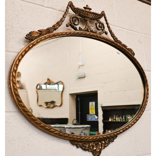 271 - An oval wall mirror with neoclassical style gilt frame, 80 cm wide x 70 cm high