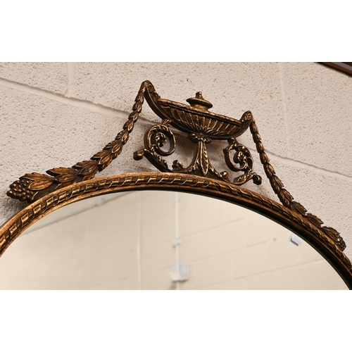 271 - An oval wall mirror with neoclassical style gilt frame, 80 cm wide x 70 cm high