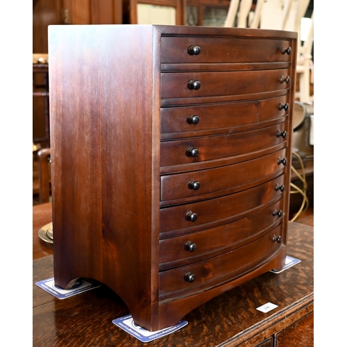 273 - A mahogany bowfront eight drawer collector's chest, 42 x 30 x 50 cm high