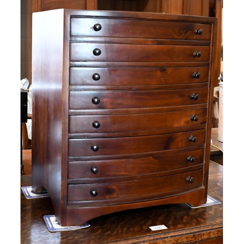 273 - A mahogany bowfront eight drawer collector's chest, 42 x 30 x 50 cm high