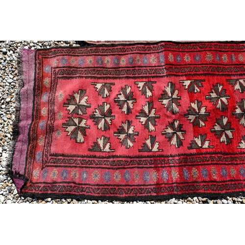 278 - Afghan red ground prayer rug, 156 x 80 cm to/w two Persian baluch rugs, 177 x 90 and 156 x 80 cm (3)