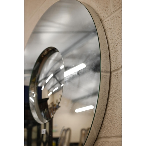 281 - # A contemporary circular wall mirror with recessed convex centre, 90 cm diam