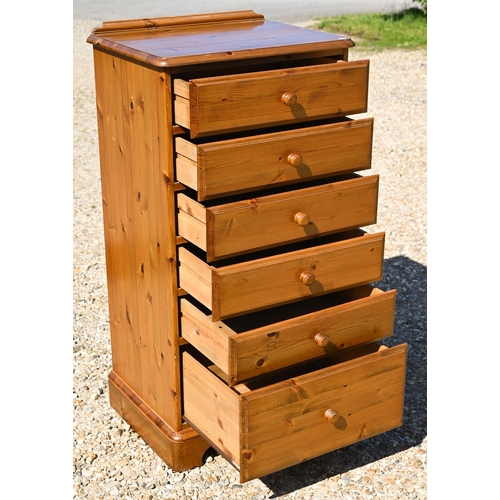 299 - A stained pine (possibly Ducal) bedroom furniture suite comprising six drawer tallboy 60 x 44 x 115 ... 