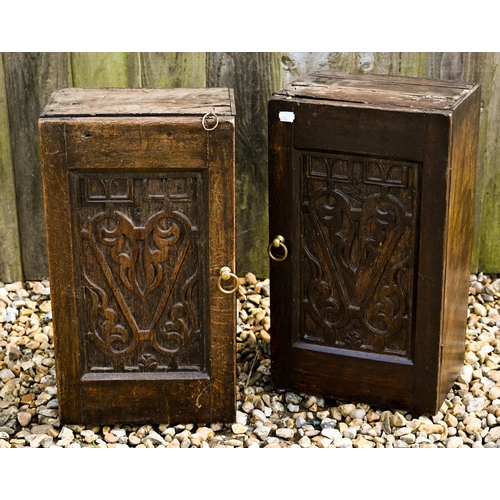 307 - A pair of small antique oak cupboards with blind fret cut panelled doors, 26 x 18 x 46 cm high to/w ... 