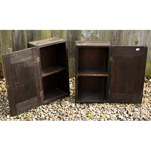 307 - A pair of small antique oak cupboards with blind fret cut panelled doors, 26 x 18 x 46 cm high to/w ... 