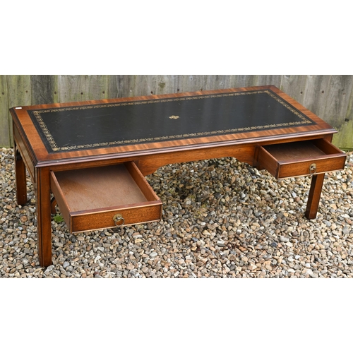 310 - # A mahogany veneered two drawer coffee table with gilt tooled leather top, 124 cm wide x 50 cm deep... 