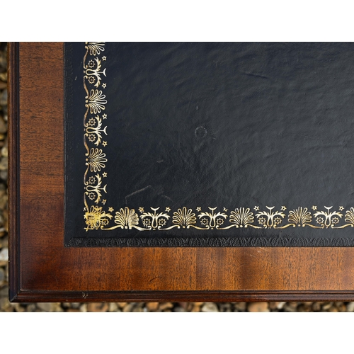 310 - # A mahogany veneered two drawer coffee table with gilt tooled leather top, 124 cm wide x 50 cm deep... 