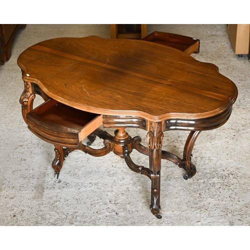 313 - A Victorian style cetnre table with shaped top and two frieze drawers on stretchered carved supports... 