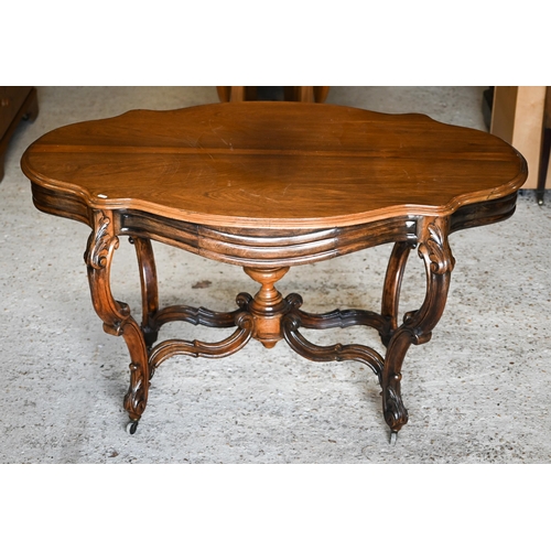 313 - A Victorian style cetnre table with shaped top and two frieze drawers on stretchered carved supports... 