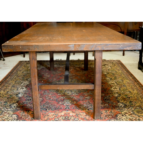 319 - A substantial elm and oak dining table with cleated rectangular top on square supports unted by stre... 