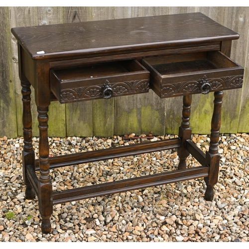 324 - # A stained elm two drawer hall table on turned supports with stretchers 80 cm x 32 cm x 74 cm h