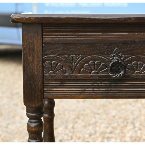 324 - # A stained elm two drawer hall table on turned supports with stretchers 80 cm x 32 cm x 74 cm h