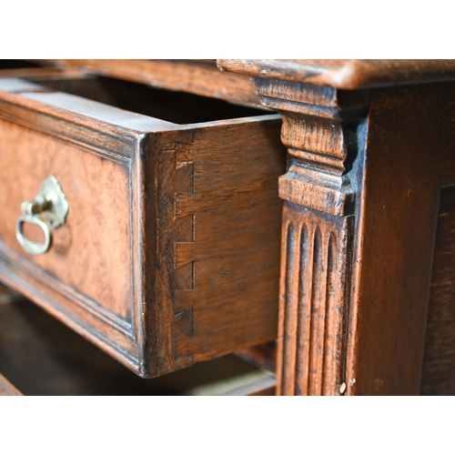 326 - an oak and walnut five drawer desk, raised on baluster turned supports united by an 'H' stretcher ba... 