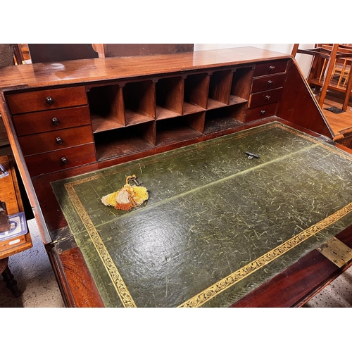 328 - A George III mahogany bureau, the slope enclosing a part fitted interior and tooled green leather su... 