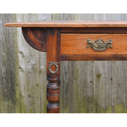 329 - A late 19th century single door oak desk, with red leather panelled top and raised on turned legs to... 