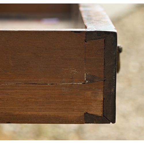 329 - A late 19th century single door oak desk, with red leather panelled top and raised on turned legs to... 