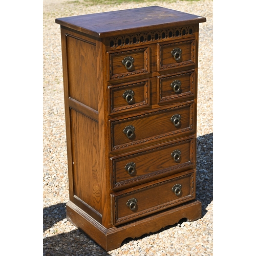 331 - Wood Bros. Ltd, a reproduction oak seven drawer hall chest, 56 cm x 38 cm x 101 cm h