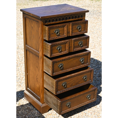 331 - Wood Bros. Ltd, a reproduction oak seven drawer hall chest, 56 cm x 38 cm x 101 cm h