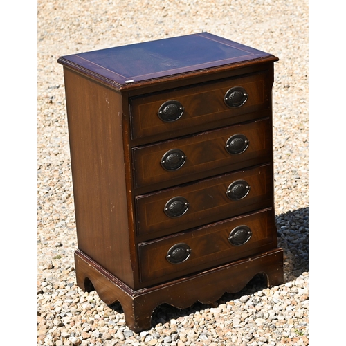 333 - A reproduction chest of four long graduated drawers, raised on shaped bracket feet, 52 cm x 38 cm x ... 