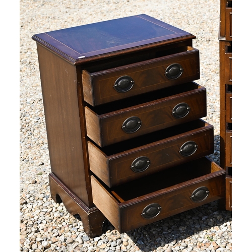 333 - A reproduction chest of four long graduated drawers, raised on shaped bracket feet, 52 cm x 38 cm x ... 