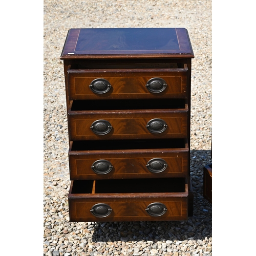 333 - A reproduction chest of four long graduated drawers, raised on shaped bracket feet, 52 cm x 38 cm x ... 