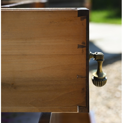 334 - # An Edwardian walnut five drawer chest raised on short square section legs to brass castors, 107 cm... 