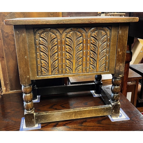 337 - A 17th century style carved oak box raised on bobbin turned supports untied by stretchers, 51 cm x 3... 