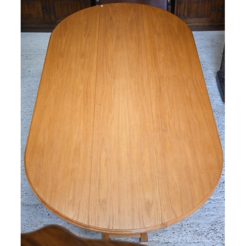 344 - A bespoke light oak dining table in wake style, the oval drop leaf top on double square section gate... 