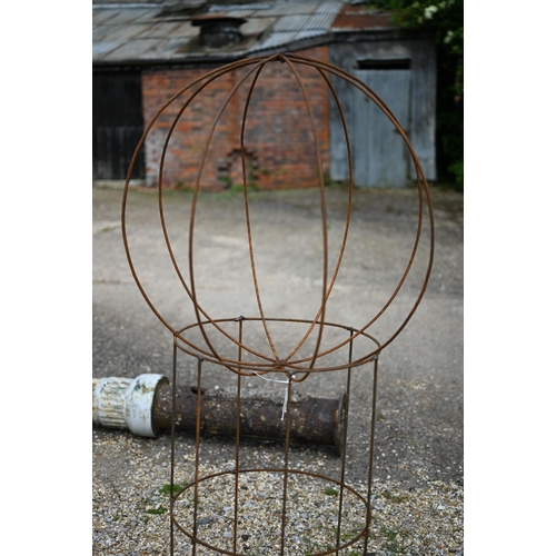 40 - A weathered steel ball on stand sweet pea frame, 140 cm h