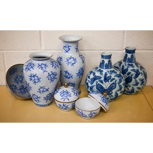 406 - A pair of modern Chinese blue and white moon flasks, decorated with butterflies to/w a suite of six ... 