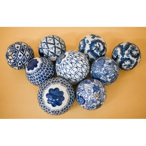 409 - A blue and white pottery stick stand, to/w nine carpet-bowls, a tureen and cover and four vases and ... 