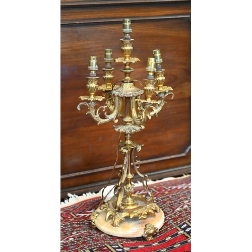 481 - An ornate vintage brass candelabrum lamp on onyx base, to/w a pair of heavy brass twin-branch wall-l... 