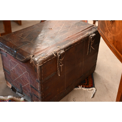 486 - An antique leather carriage trunk with stitched decoration and metal binding, 69 x 44 x 44 cm