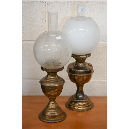 487 - Two oil lamps with globe shades