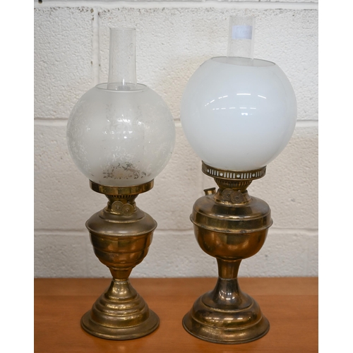 487 - Two oil lamps with globe shades