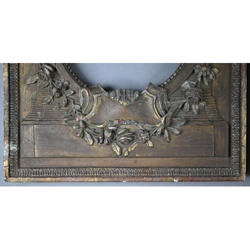 525 - A pair of 19th century gilt gesso frames with oval apertures, floral and ribbon mouldings, 38 x 28 c... 