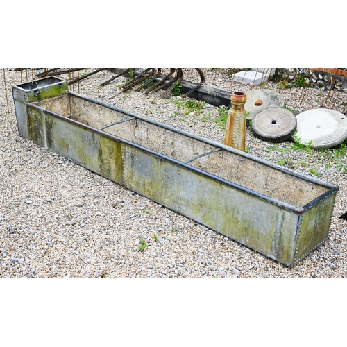 61 - A large galvanised and riveted agricultural water trough planter, 308 cm x 50 cm x 50 cm o/a