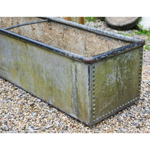 61 - A large galvanised and riveted agricultural water trough planter, 308 cm x 50 cm x 50 cm o/a