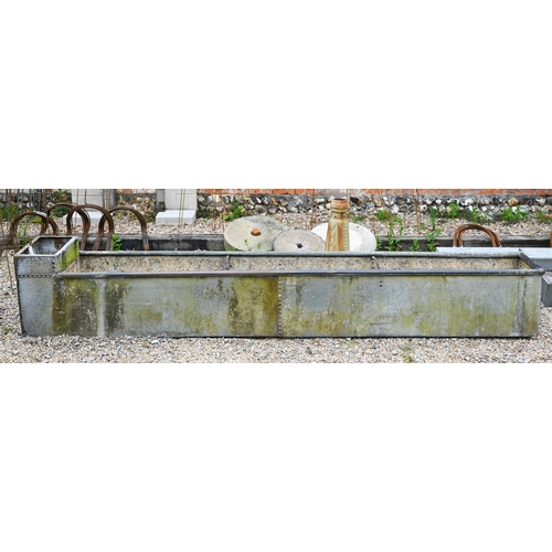 61 - A large galvanised and riveted agricultural water trough planter, 308 cm x 50 cm x 50 cm o/a