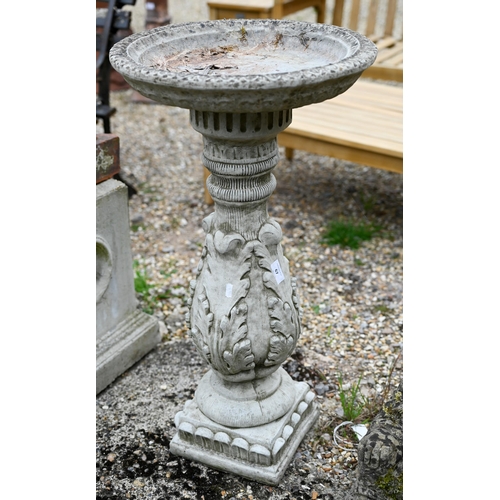 67 - A weathered cast stone birdbath, 76 cm h