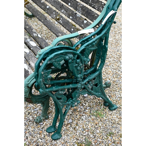 68 - An old weathered teak slat garden bench, with cast iron dragon arm ends, 155 cm wide, to/with a pair... 