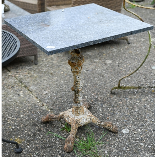 69 - An old cast iron garden table base with associated composite square top to/with an old weathered cir... 