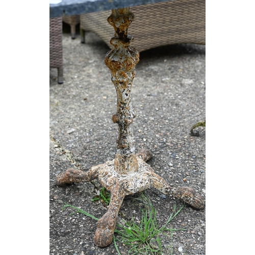 69 - An old cast iron garden table base with associated composite square top to/with an old weathered cir... 