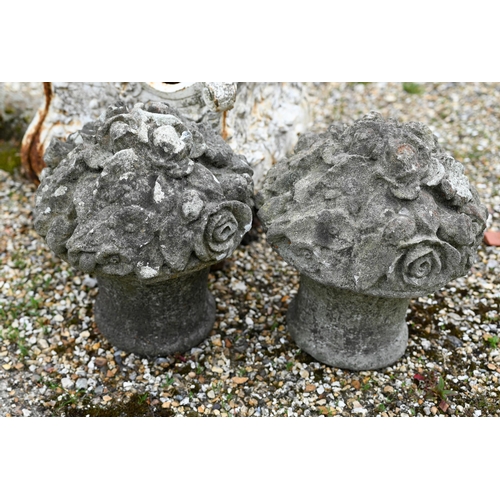 74 - A pair of cast stone floral basket finials to/with an old cast iron planter and a cast stone reclini... 