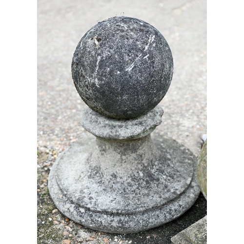 76 - A trio of weathered cast stone ball finials and bases, sizes and designs differ (3)